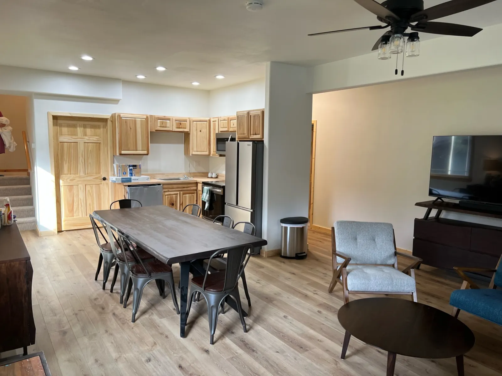 Finished kitchen and dining area with wood-look plank flooring